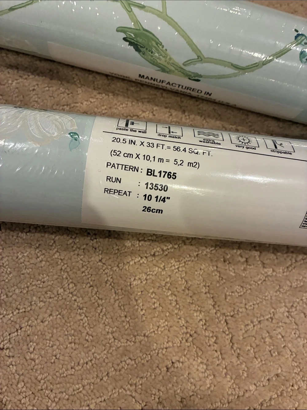 Two unopened rolls Floral Vine Wallpaper in Light Blue and White